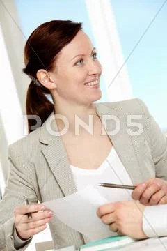 Happy businesswoman during discussion of new business strategy at meeting Stock-Fotos