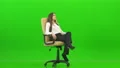 The happy businesswoman gesturing on the office chair on the green background 4k or 4k+ Resolution