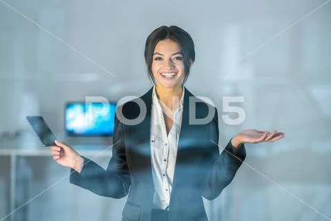 The happy businesswoman hold a phone over the window Stock Photos