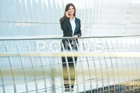The happy businesswoman phone on the office balcony Stock Photos