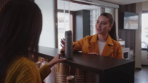 Happy cafe customer bringing reusable coffee cup for refill Video stock 244601646