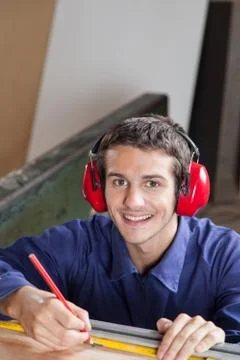 Happy carpenter in his workshop Stock Photos
