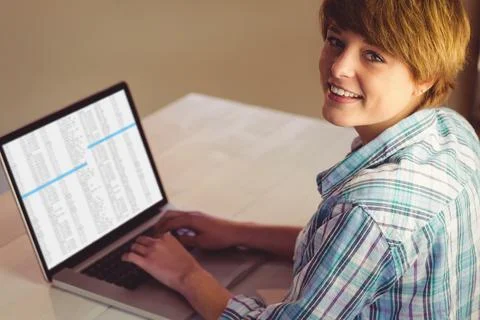 Happy caucasian female programmer using laptop with coding on screen Stock Photos