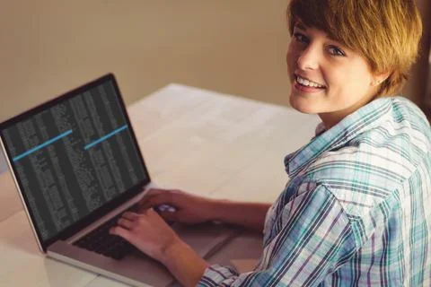 Happy caucasian female programmer using laptop with coding on screen Stock-Fotos