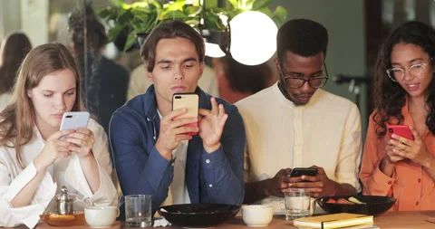Happy caucasian man finding solution and showing smartphone content to coworkers Stock Footage 137014674