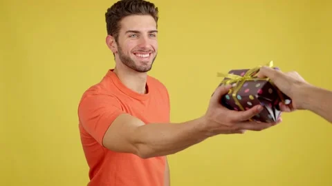 Happy caucasian man smiling while receiving a gift Video stock 234862611