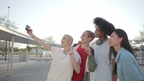 Happy centennial people using phones and taking smiling selfie. Group of Stock Footage 234087953