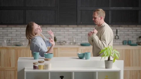 Happy Cheerful Couple Dancing On Kitchen While Cooking Together. Stock Footage 153272885