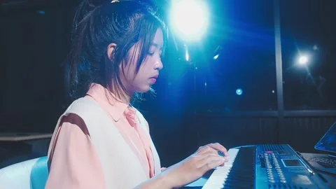 Happy cheerful pretty smiling of young Asian woman vocalist Wearing Headpho.. Stock Footage 293114264