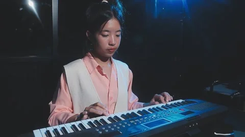 Happy cheerful pretty smiling of young Asian woman vocalist Wearing Headpho.. Stock Footage 293114565