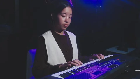 Happy cheerful pretty smiling of young Asian woman vocalist Wearing Headpho.. Stock Footage 293114572