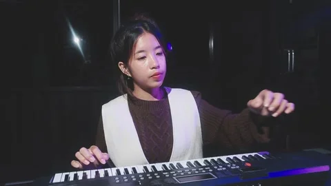 Happy cheerful pretty smiling of young Asian woman vocalist Wearing Headpho.. Stock Footage 293114860