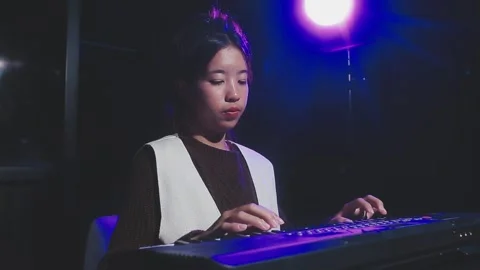 Happy cheerful pretty smiling of young Asian woman vocalist Wearing Headpho.. Stock Footage 293115257