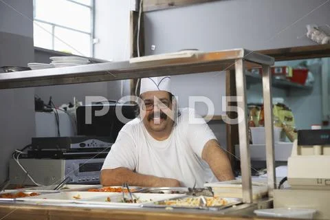 Happy Chef In Commercial Kitchen Stock Photos