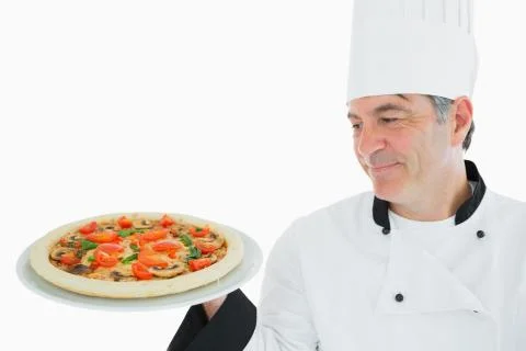 male chef holding a pizza box open Stock Photo