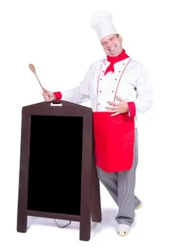 Happy chef standing with an blank menu Stock Photos
