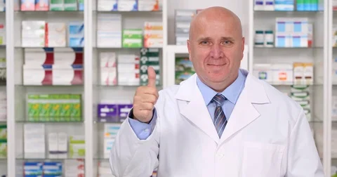 Happy Chemist Presenting Thumbs Up Gesture in a Pharmaceutical TV Advertising Stock Footage 83674045