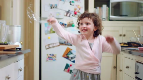 Happy, child and dance with magic wand in home for creative imagination, playing Stock Footage 335848835