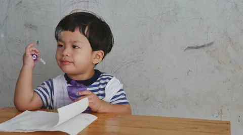 Happy child blowing soap bubbles in the room on dirty wall background, 스톡 동영상 58006006