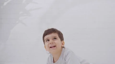 Happy child boy having fun frolicking in the morning Stock-Footage 244102114