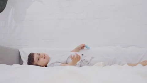 Happy child boy having fun frolicking in the morning Stock Footage 244102257