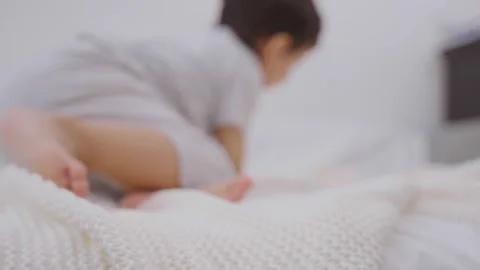 Happy child boy having fun in parents bedroom in the morning Stock-Footage 244342892