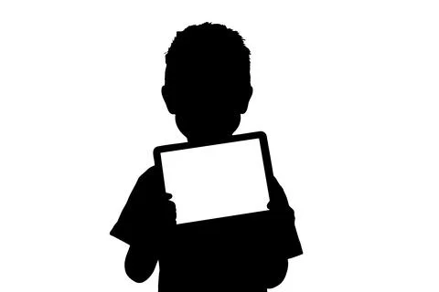 Happy child boy holding a tablet for your information on the blue background Stock Illustration