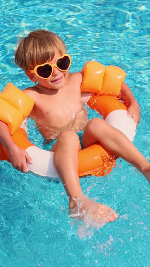 A happy child is having fun on the beach during the summer holidays. Slow m.. Stock Footage 335764057