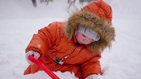 Happy child having fun playing in the park on a sunny winter day. Snow winter Video stock 72424885