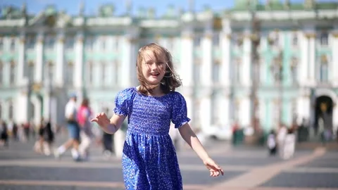 Happy child jumping on Palace Square in Saint Petersburg Stock Footage 315536578