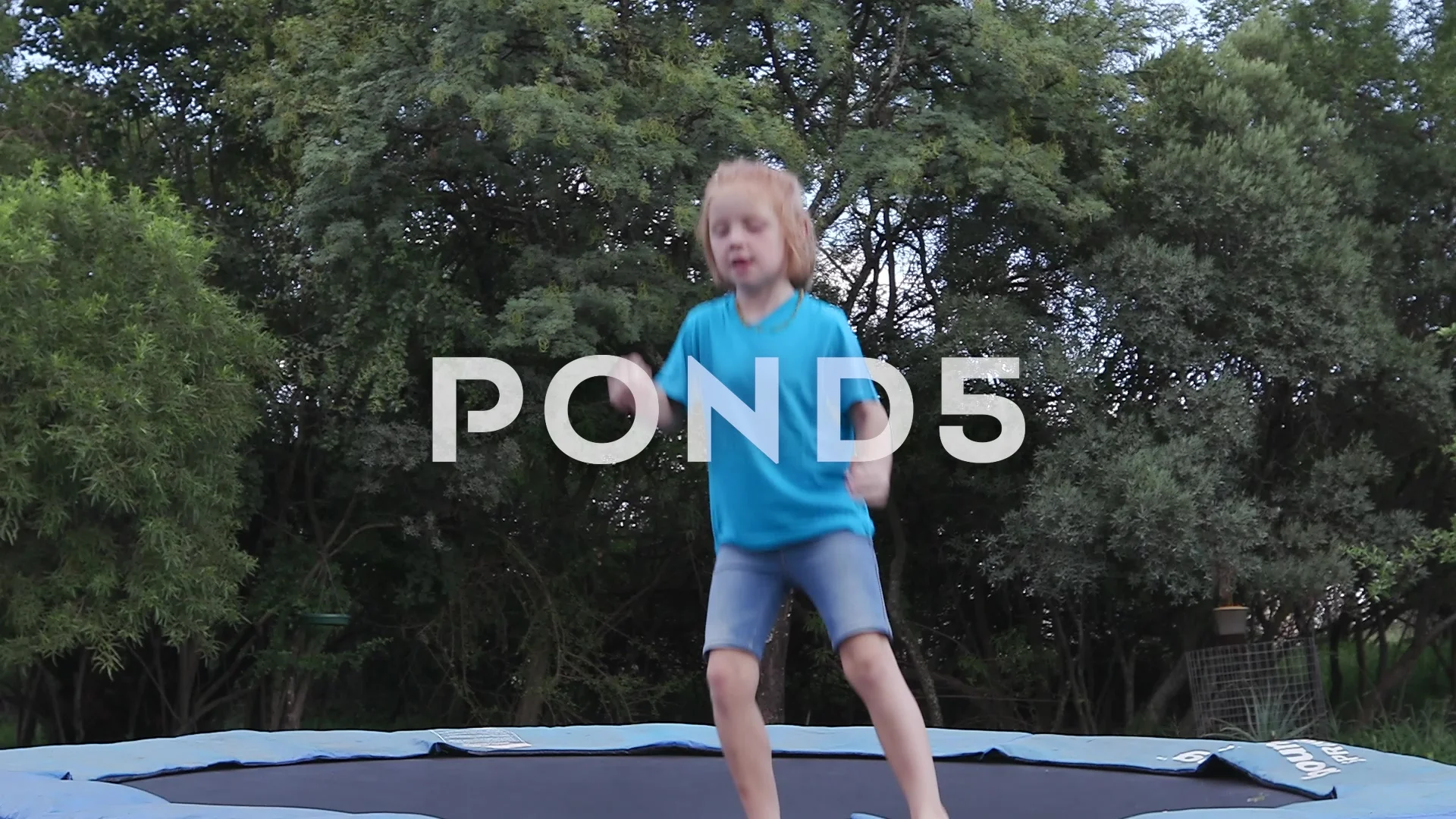 Happy child jumping on in | Stock Video |