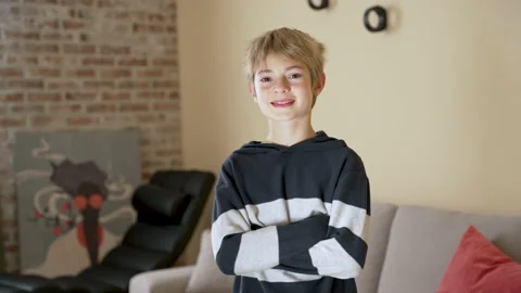 Happy child looking to camera, smiling at home interior Stock Footage 239441739