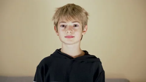 Happy child looking to camera, smiling at home interior Stock Footage 239441922