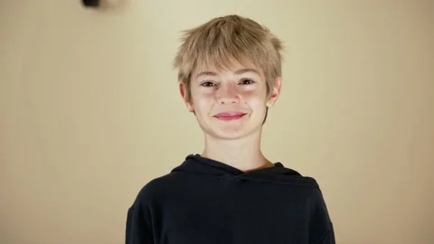 Happy child looking to camera, smiling at home interior Stock Footage 239452311