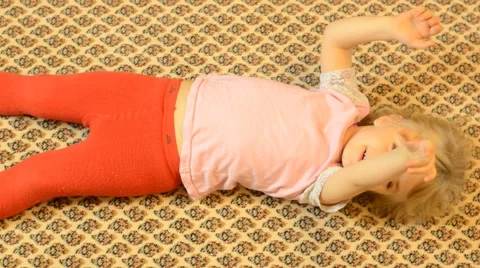Happy Child Lying on a Carpet, Crazy Emotions Vídeos de archivo 47163694