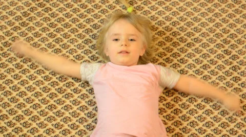 Happy Child Lying on a Carpet, Crazy Emotions Stock Footage 47163837