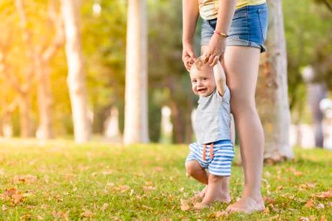 Happy Child Making First Steps Stock Photos