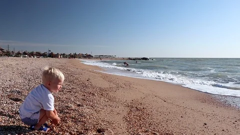 Happy child playing on the beach Stock Footage 94622874