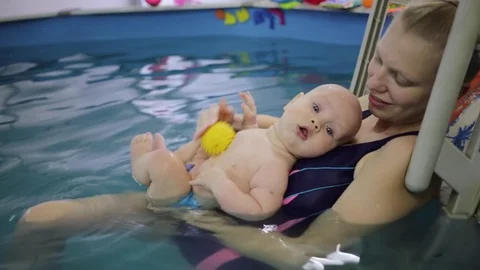 Happy. the child in the pool with the coach. Stock Footage 82006554