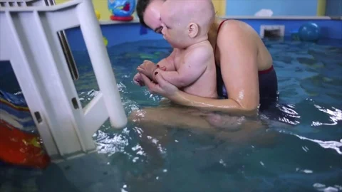 Happy. the child in the pool with the coach. Stock Footage 82256633