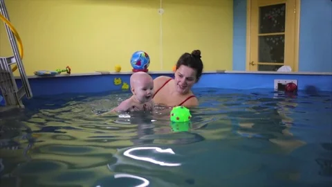 Happy. the child in the pool with the coach. Stock Footage 82256648