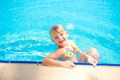 Happy child in the pool Stock Photos