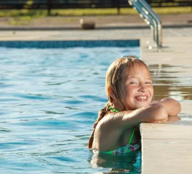 Happy child at pool Stock Photos