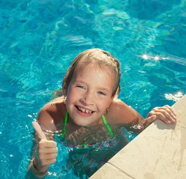 Happy child at pool Stock Photos