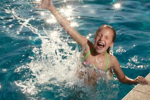 Happy child at pool Stock Photos