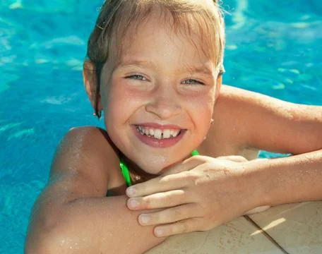 Happy child at pool Stock Photos
