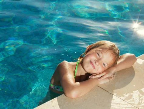 Happy child at pool Stock Photos