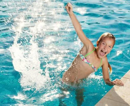 Happy child at pool Stock Photos