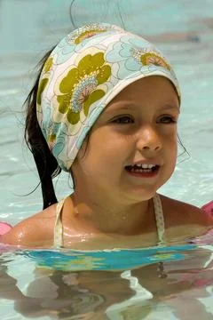 Happy child in pool Stock Photos