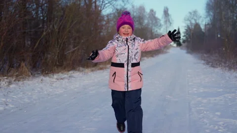 Happy child running looking at camera at winter woods outdoors Stock Footage 166988811